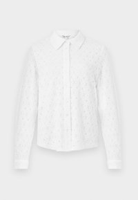 Camicia bianca con bottoni realizzata in pizzo testurizzato, dotata di colletto, maniche lunghe e una pattina anteriore con bottoni. Motivo floreale su tutta la superficie.