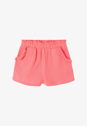 Coral pink toddler shorts with elastic ruffled waistband and two front pockets featuring ruffle trim, textured lightweight fabric.