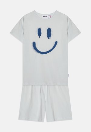Light gray cotton two-piece set featuring a navy blue spray-painted smiley face. Short sleeves and knee-length shorts with an elastic waistband.