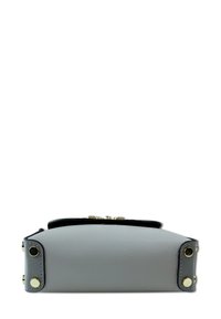Gray leather bag with a structured shape, featuring black accents and gold hardware on the side. Textured surface with visible seams.