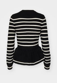 Svart och vit randig stickad tröja med långa ärmar, rund halsringning och peplum-kantning vid midjan.