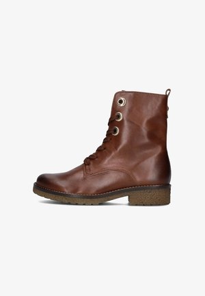 Botte chelsea en cuir marron avec un laçage à l'avant comportant quatre œillets en métal et une semelle en caoutchouc texturée avec un talon bas.