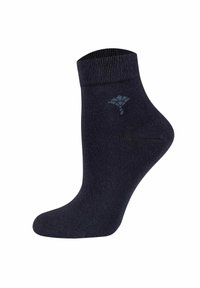 Calzino alla caviglia di un blu scuro, realizzato in materiale elasticizzato, con un polsino a coste, una texture liscia e un logo sottile stampato in azzurro. Virginie