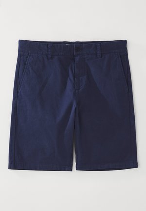Marineblå bomullsshorts med rett snitt, som har beltehemper, frontlås med knapp, og to sidelommer. Glatt tekstur.
