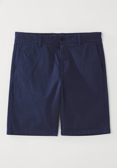 Shorts en coton bleu marine à coupe droite, avec passants de ceinture, fermeture à bouton devant et deux poches latérales. Texture lisse.