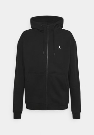 Czarna bluza z kapturem na zamek, z regulowanym sznurkiem przy kapturze, kangurzymi kieszeniami oraz małym białym logo Jumpman na lewej piersi.
