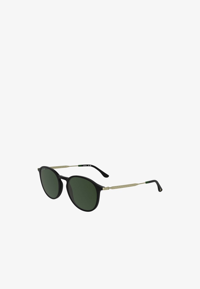 Kerek napszemüveg fekete műanyag kerettel és zöld színű lencsékkel. Arany fém díszítések a szárakon, zöld csíkkal.