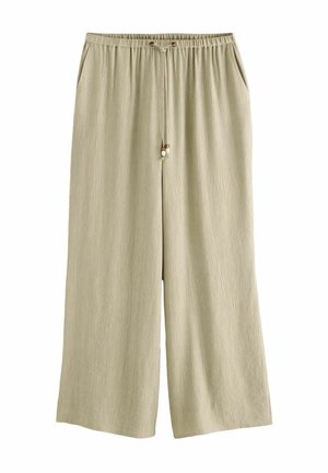 Pantaloni larghi beige chiaro in tessuto testurizzato, con vita elastica, due tasche laterali e lacci decorativi con perline sul davanti.