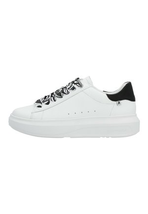 White low-top sneaker with chunky sole, black and white patterned laces, and black heel detail.