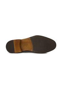Brown leather shoe sole with textured rubber bottom, tan stitched accents, and embossed label reading "SOLE 12." Flat design with slight flex.
