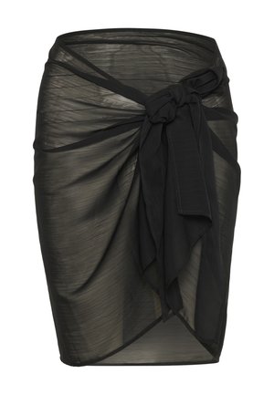 Jupe noire transparente avec un détail de nœud à la taille. Présente un design drapé et une texture légèrement translucide.