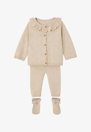 Beige knitted baby outfit with ruffled collar cardigan, matching pants, and booties with bow details.