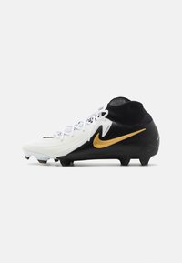 Scarpini da calcio con una tomaia bianca, accenti neri e il logo Nike in oro. Materiale testurizzato con un colletto simile a una calza e tacchetti moldati.