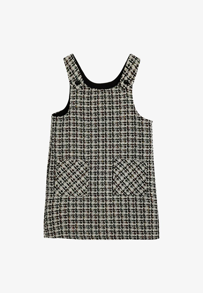 Tweedklänning i svart, vitt och rött mönster. Fyrkantig halsringning, breda axelband och två framfickor. Strukturerad tyg.