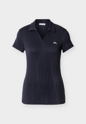 Tumesinine lühikeste varrukatega polosärk, millel on vertikaalne triibumuster ja vasakul rinnal väike valge logo. Särgil on klassikaline krae ja v-kaelus.