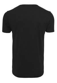 T-shirt noir à manches courtes en coton lisse, avec un col rond et une coupe droite, sans motifs ni embellissements.