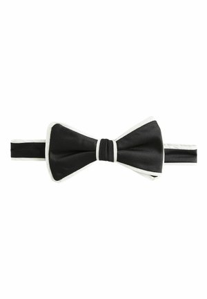Black bow tie with vertical ribbed texture, featuring a white satin trim and center knot. Adjustable band for a secure fit.