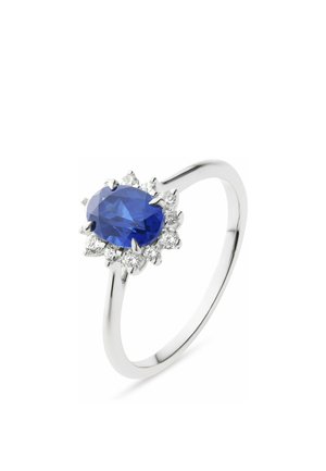 Weißgoldring mit einem zentralen ovalen blauen Saphir, umgeben von kleinen runden weißen Diamanten in einer floralen Clusterfassung.