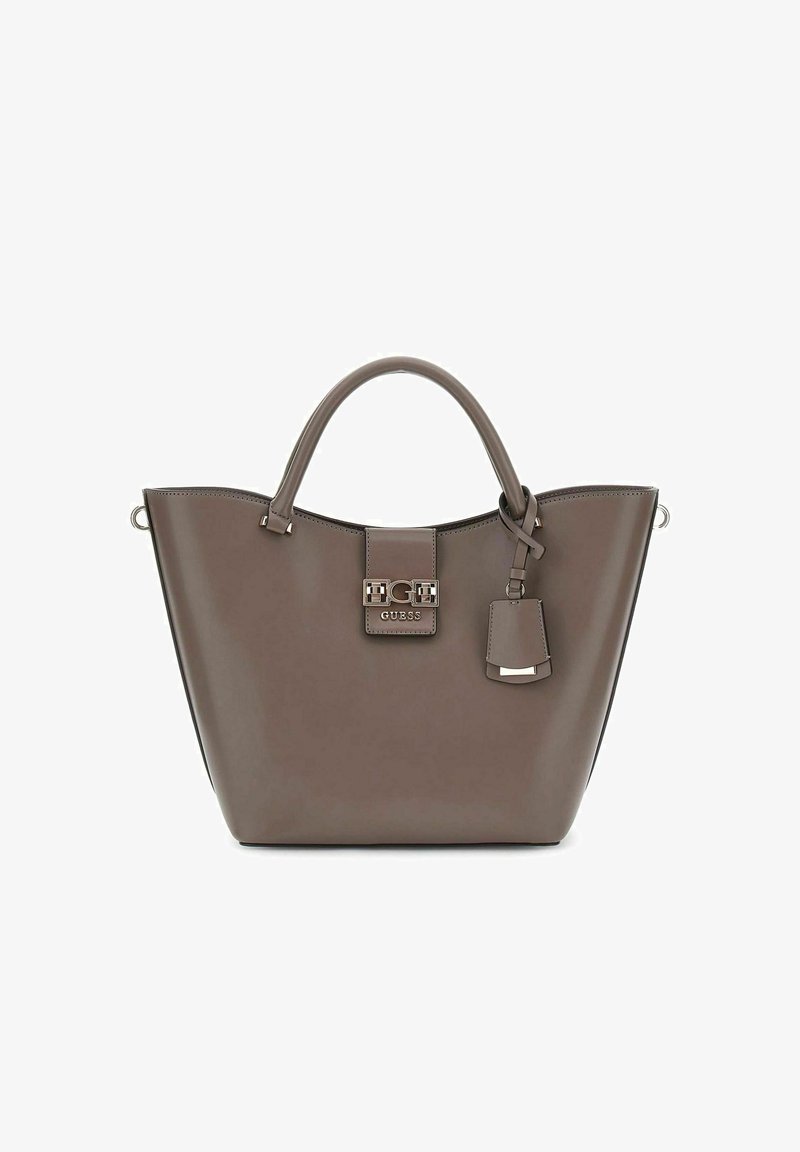 Sac fourre-tout en simili cuir marron avec deux poignées, forme structurée, matériel logo sur le rabat avant et une étiquette amovible.