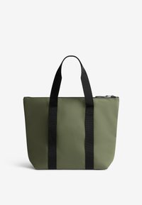 Green tote bag made of smooth, durable material, featuring black webbed handles and a zip closure at the top. Rectangular shape with no patterns.