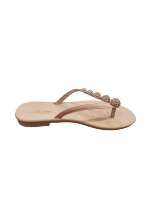 Sandalo basso beige con sottili cinturini e sei perle decorative rotonde lungo il cinturino superiore.