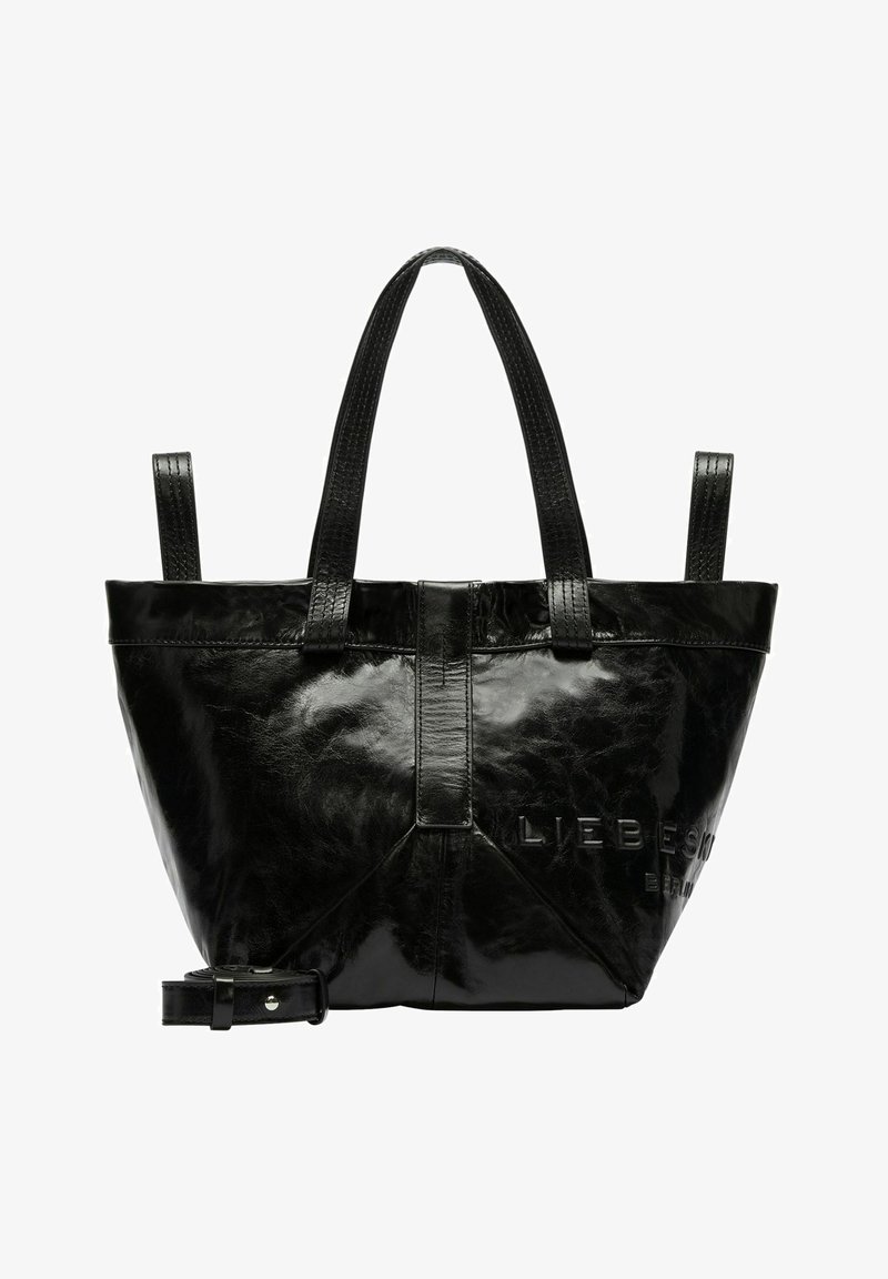 Sac fourre-tout en cuir noir avec texture lisse, deux poignées supérieures, une bandoulière ajustable, une marque en relief et un design de base triangulaire.