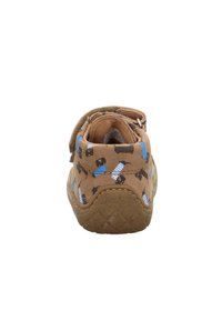 Brown slip-on shoe featuring a playful pattern of black dogs wearing blue stripes, textured rubber sole, and padded interior for comfort.