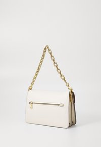 White leather handbag with a gold chain strap, featuring a front zip pocket and a rectangular shape. Smooth texture and minimalistic design.
