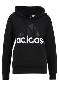 Sudadera negra hecha de tela suave, con un gran logo blanco de "adidas" y un acento triangular en la parte frontal. Incluye capucha con cordón.
