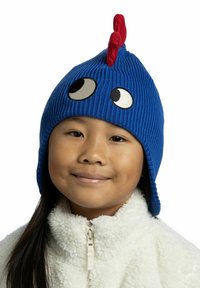 Blue knitted hat with a ribbed texture, featuring large white and black eyes and a red fabric appendage at the top.