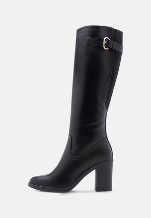 Knee-high black synthetic boots with a square toe, block heel, side buckle detail, and smooth surface texture.