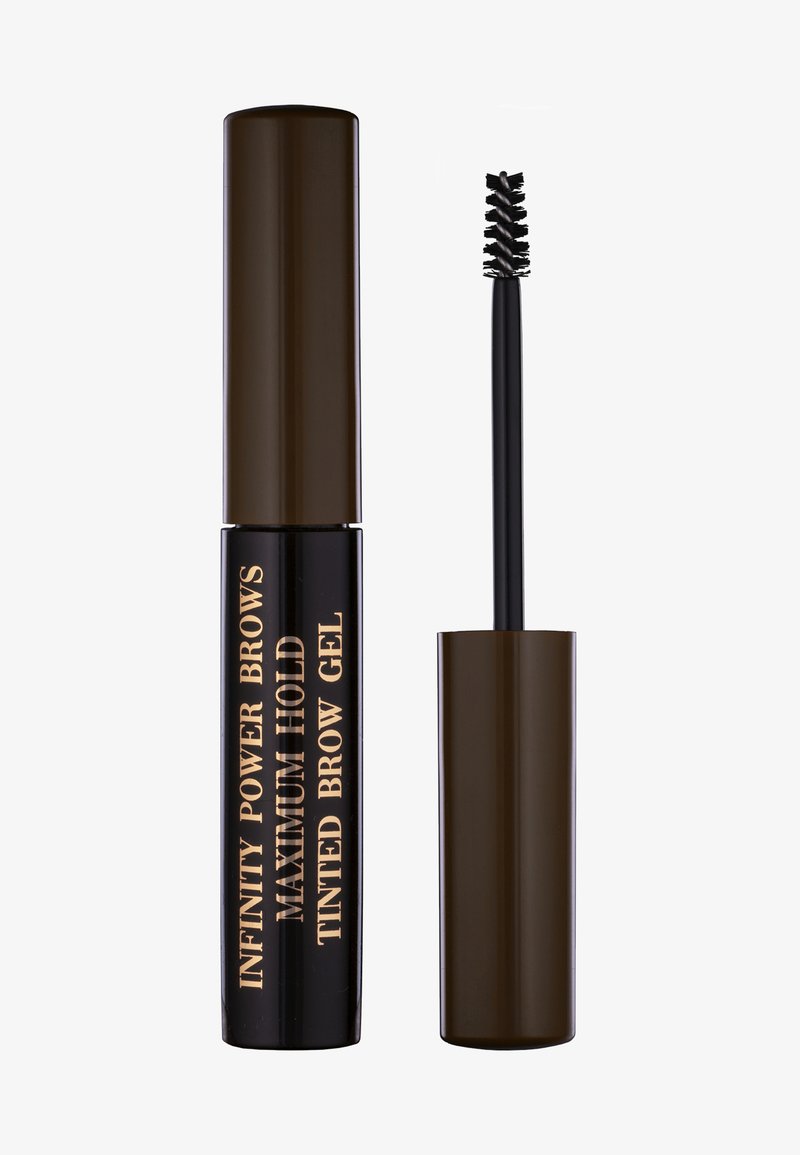 Farget bryngele i en brun tube med gulltekst. Inkluderer en spiralbørste for påføring. Glanset finish, kompakt design, mørk farge.