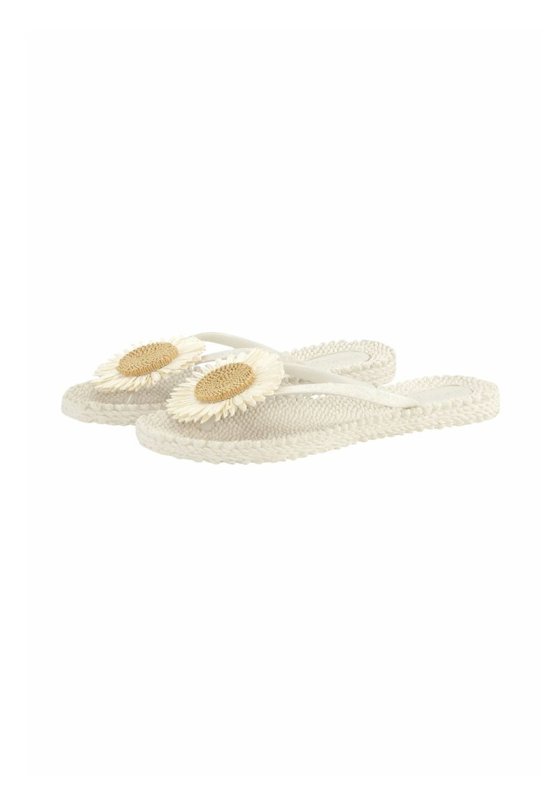 White woven flip-flops with large decorative sunflower on straps, flat sole, and braided texture, shown against a white background.