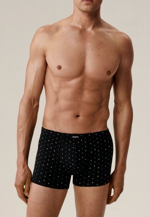 Czarne bokserki z wzorem małych kolorowych serc. Miękka tkanina i dopasowany krój, z elastycznym pasem w talii z nazwą marki "ATLANTIC."