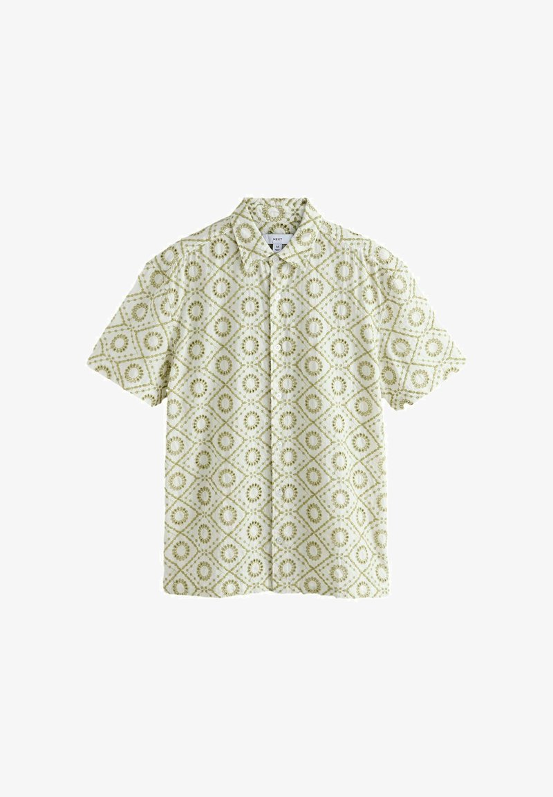 Chemise à manches courtes avec boutons, présentant un motif géométrique de diamants et de cercles verts et blancs.