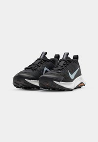 Black athletic shoes with a textured upper, light blue swoosh, and white midsole. Features pull tabs and rugged rubber outsole for traction.