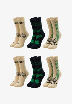 Zes paar beige en zwarte sokken met Jurassic World-ontwerpen, met dinosaurussen, helmen en tekst in groen en zwart.