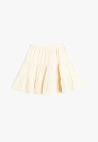 Falda de longitud a la rodilla en tejido crema con sutiles rayas verticales, que presenta una cinturilla elástica y bordes rizados para un movimiento fluido.