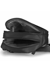 Black fabric bag featuring a zipper closure, multiple compartments, mesh pocket, and adjustable strap for secure storage and organization.