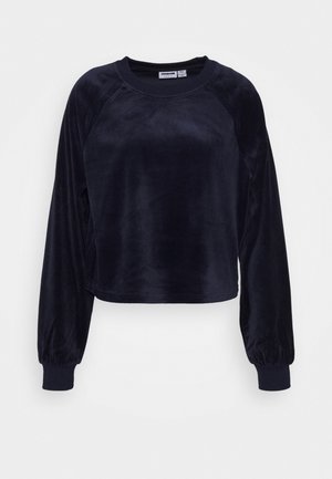 Sweat-shirt noir en velours à manches longues avec col rond et poignets élastiques sur fond blanc, présenté à plat.