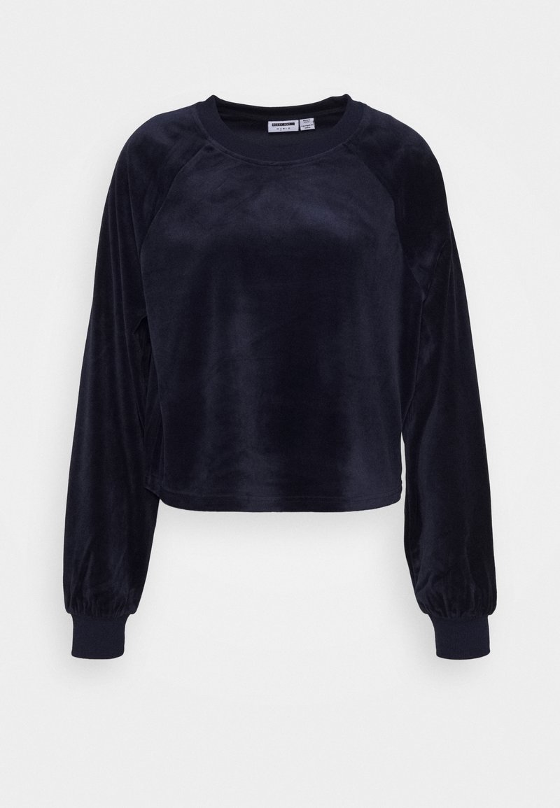 Sweat-shirt noir en velours à manches longues avec col rond et poignets élastiques sur fond blanc, présenté à plat.