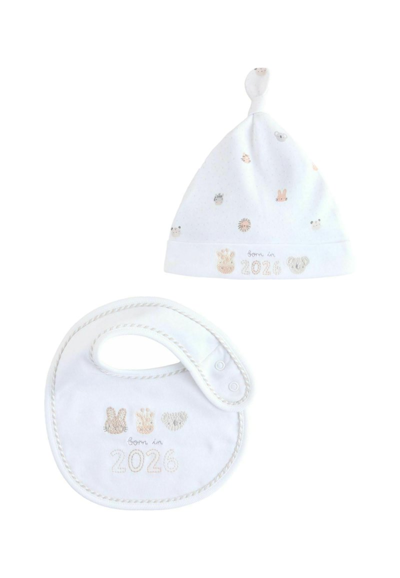 White cotton baby hat with a knot top and scattered animal prints; matching bib featuring embroidered "Born in 2026" and animal motifs.