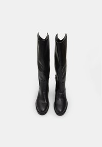 Black leather knee-high boots with a smooth texture, pointed tops, and minimalistic design. Features a side zip and flat soles.