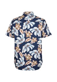 Camicia a maniche corte con sfondo blu navy decorato da grandi foglie tropicali bianche e marroni e motivi floreali. Tessuto dalla superficie liscia.
