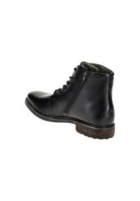 Schwarze Lederstiefeletten mit glatter Oberfläche, ausgestattet mit einem Schnürverschluss vorne, einem seitlichen Reißverschluss und einer Kork- und Gummisohle mit holzähnlicher Optik.