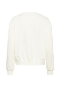Sweatshirt blanc avec un col rond, des épaules tombantes et des poignets et un ourlet côtelés. Fabriqué en tissu doux avec une texture lisse.