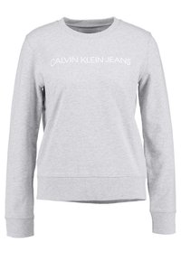 Felpa grigia in misto cotone con orlo e polsini a coste. Presenta un logo bianco "CALVIN KLEIN JEANS" sulla parte anteriore.
