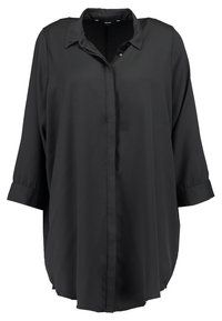 Camicia nera a maniche lunghe con colletto, realizzata in tessuto morbido; presenta una chiusura con bottoni e polsini arrotolati. Orlo dritto.