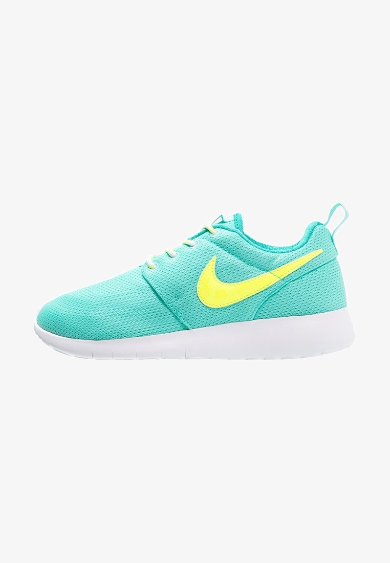 Turquoise mesh sneakers with a white sole and bright yellow Nike swoosh. Features lace-up design and textured fabric surface.