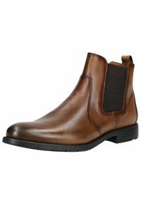 Braune Chelsea-Stiefel aus Leder mit elastischen Seitenpaneelen, runder Zehenpartie und niedrigem schwarzen Gummihügel. Glatte Textur mit minimalen Nähdetails.